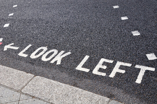 Look Left Warning at Crossing on Road
