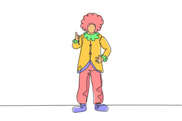 Continuous one line drawing clown stands with a thumbs-up gesture wearing wig and clown costume ready to entertain the audience in the circus arena. Single line draw design vector graphic illustration
