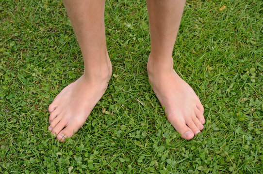 Close-up of Boy's Bare Feet on Grass, Alps, France