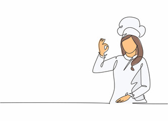 Single continuous line drawing of young excited beauty attractive female chef pose standing and giving okay gesture. Restaurant banner concept one line drawing design vector graphic illustration