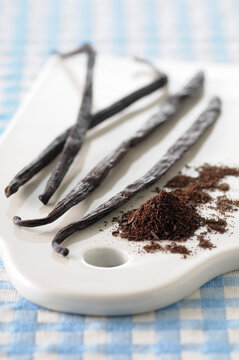 Close-up of Vanilla Beans and Ground Vanilla on Cutting Board