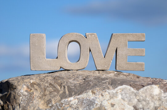 Close-up of Stone LOVE on Rock with Blue Sky, Frontignan, Herault, France