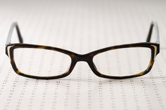 Close-up of Eyeglasses on Eye Exam Chart, Studio Shot