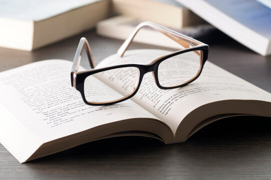 Close-up of Eyeglasses on Open Book, Studio Shot
