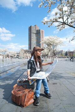 Woman Looking at Map, Mannheim, Baden-Wurttemberg, Germany