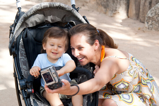 Mother taking Picture of Herself and Boy
