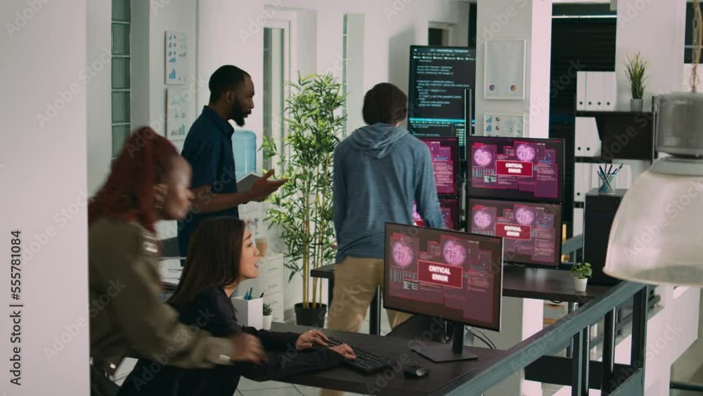 Poster multiethnic group of app developers reading critical errors on multiple monitors in it agency, being