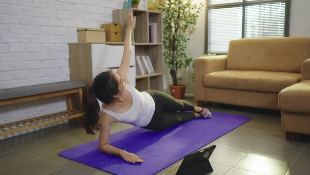 Asian women exercise indoor at home
