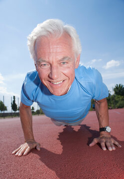 Man Exercising Outdoors on Track