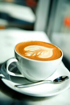 Coffee with Special Design in Coffee Cup on Counter