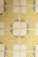 Foto auf Acrylglas Dirty vintage tiles with geometric patterns. Yellow and black tiles background © Toyakisfoto.photos