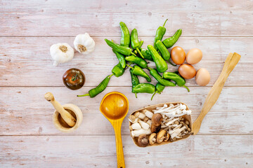 Still life with fresh uncooked food with wooden kitchen accessories