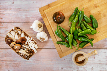 Still life with fresh uncooked food with wooden kitchen accessories