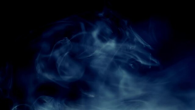 Vape Smoke. Сloud Of Gray Smoke With Blue Tints Fills Entire Frame On Left Side Against Black Background For Overlay And Takes Long Time To Dissipate 4k Resolution.