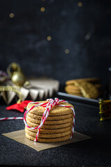 a stack of cookies tied with a Christmas ribbon