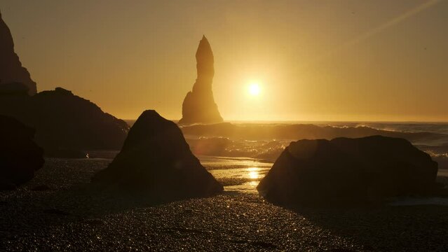 Black Volcanic Coastline In Iceland, Sunset over Black Sand Beach Vik, Famous Cliffside, Shot in 8K Resolution 4320p