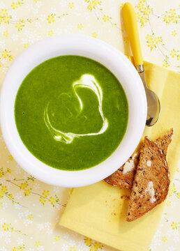 Overhead View of Green Soup with Buttered Toast