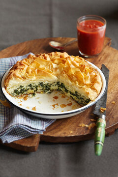 Spinach and feta phyllo pie with tomato sauce on the side