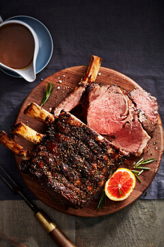 Citrus and rib roast on a wooden cutting board