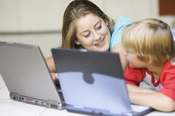 Girl and Boy Using Laptop Computers