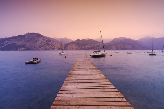 Dock and Boats on Mountain Lake, Lago di Garda, Italy