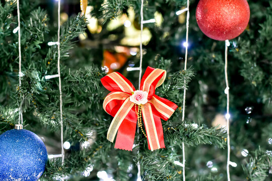 Festive Xmas Background. Bright Glowing Blur Christmas Tree Bokeh Lights. Traditional Decor for Winter Holidays. Abstract Cozy Winter.