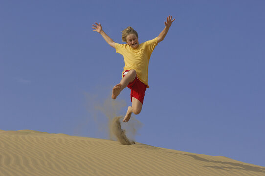 Boy Playing in Sand Dunes, Playa del Ingles, Cran Canaria, Canary Islands