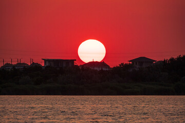 The sun goes down over a lake