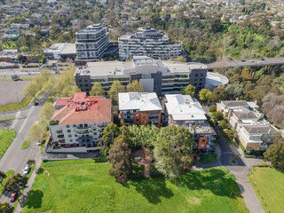 Aerial view of inner city apartments near green parkland