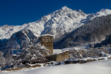 Traditional Svan towers and houses surrounded by the high mountains of the Caucasus, Svaneti,...