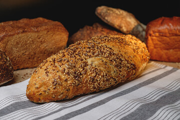 Multigrain sourdough bread with other craft bread in the background
