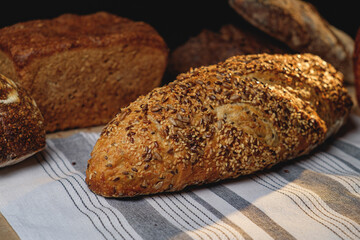 Multigrain sourdough bread with other craft bread in the background