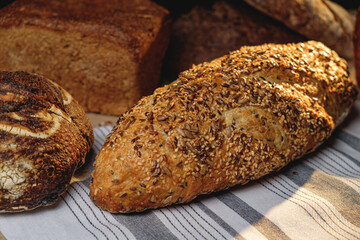 Multigrain sourdough bread with other craft bread in the background
