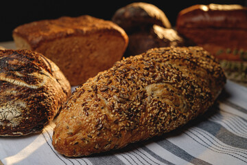 Multigrain sourdough bread with other craft bread in the background