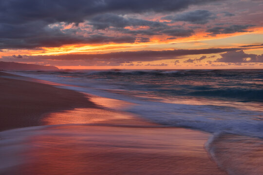 Sunset and surf on the Pacific Ocean at Sunset Beach on Oahu, Hawaii, USA