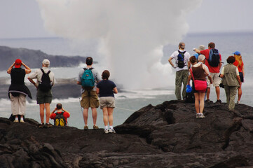 Tourists Standing on Lava, Looking at the Ocean, Hawaii, USA