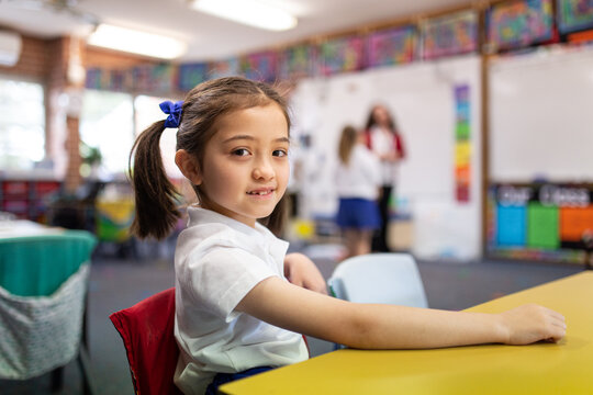 Young Schoolgirl Smiling at Camera