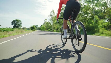 Asian men are cycling road bike in the morning