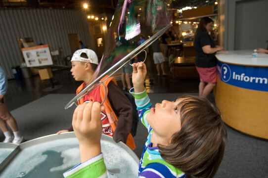 Children Blowing Large Bubbles