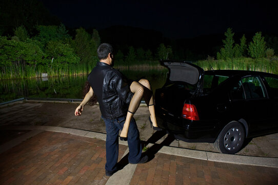Man Disposing of Woman's Body