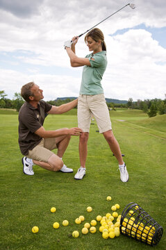 Woman Learning How to Golf, Burlington, Ontario, Canada