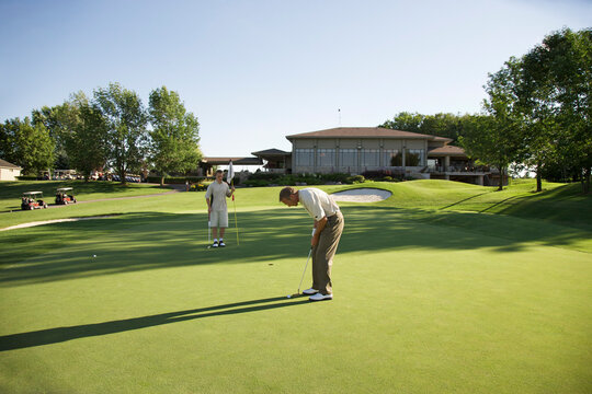 Men Playing Golf, Burlington, Ontario, Canada