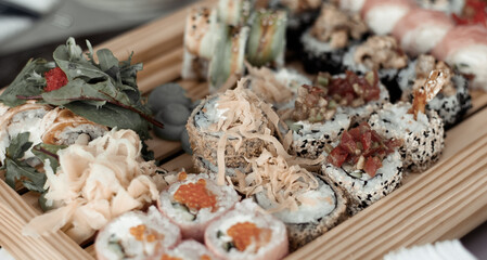 Sushi set on a wooden serving close-up