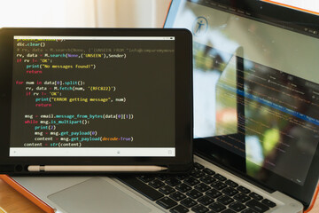 Young asian man programer developer coding software about intelligence innovation. Young man programmer writes program code on a computer. home office .