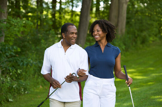 Couple Walking on Golf Course