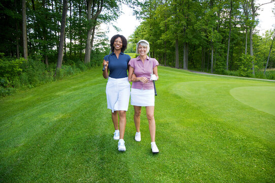 Women Walking on Golf Course