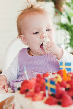 Little Girl Eating Cake