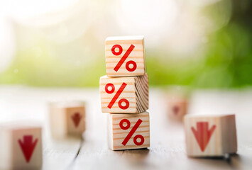 Interest rate financial and mortgage rates concept. Wooden cube block with interest rate and down...