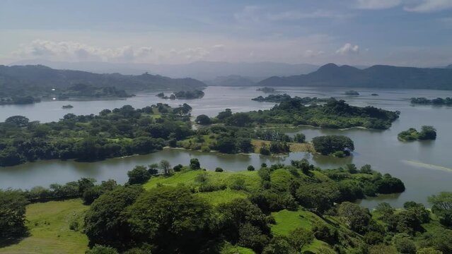 Aerial view of the Suchitl&aacute;n lake reservoir in Chalatenango, El Salvador - Pan left