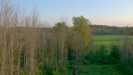 Drone aerial of the neighboring farms near the  Joseph Smith family farm, frame house, temple, visitors center, and the sacred grove in Palmyra New York Mormons and the book of Mormon.